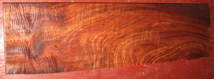 Curly koa $45 + $18 shipping
20" x 5-1/4", planed to 15/16" thickness.
Wild figure, especially strong curl at one end. Air dried since 2005. 
face #1   -   board #165-1716